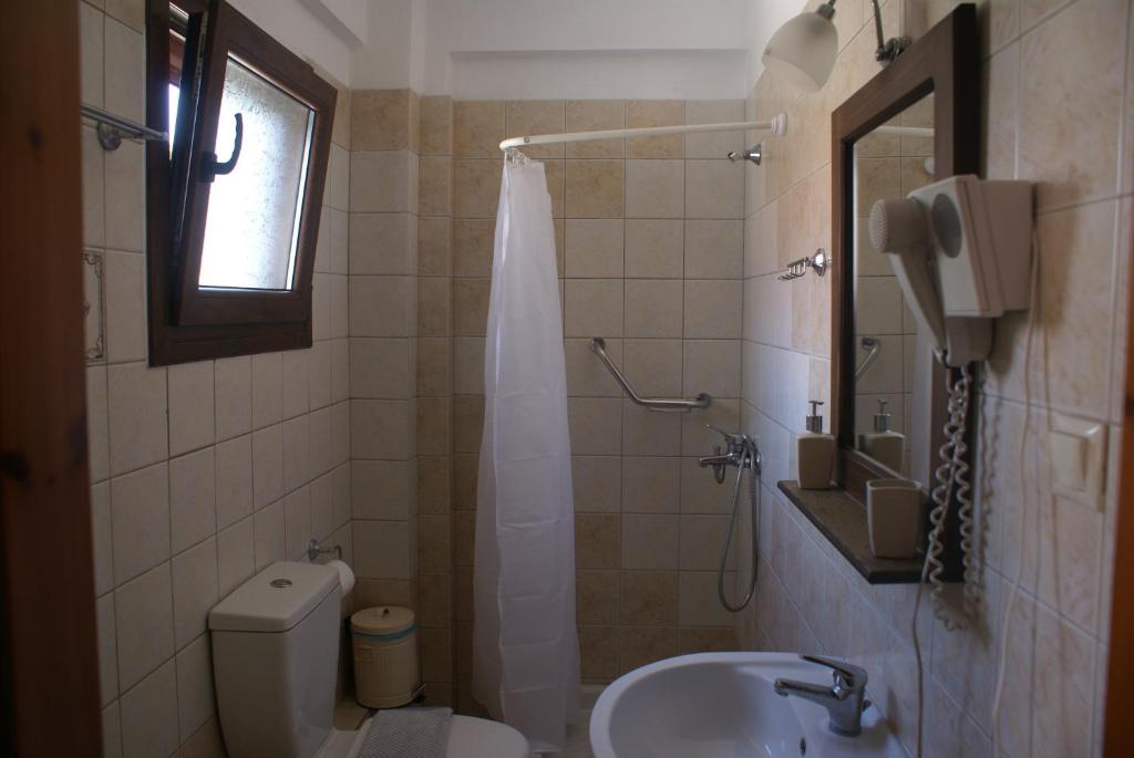 Koupelna v ubytování Nostos Rooms Ammouliani