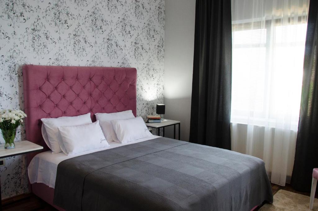 Ein Bett oder Betten in einem Zimmer der Unterkunft Serendipity