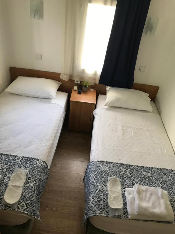 Postel nebo postele na pokoji v ubytování Tay Pansiyon