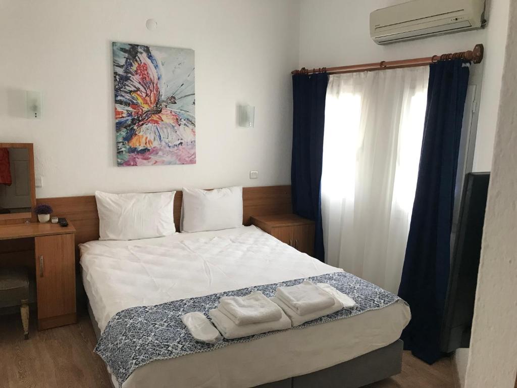Postel nebo postele na pokoji v ubytování Tay Pansiyon