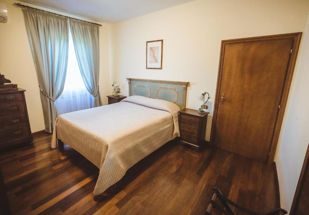 A bed or beds in a room at Agriturismo Le Anfore