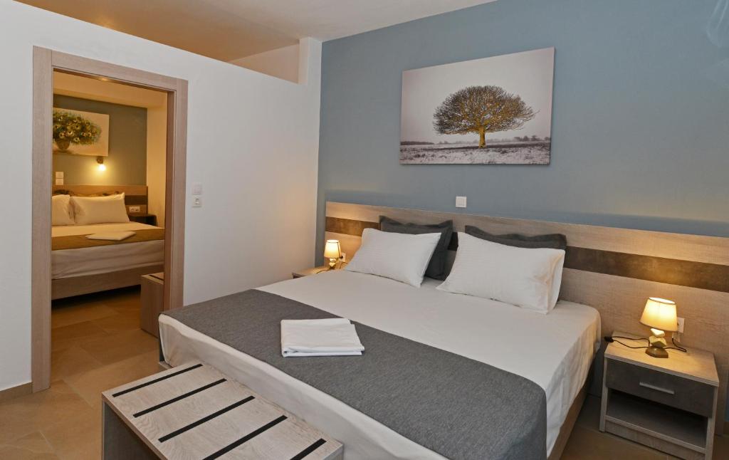 Postel nebo postele na pokoji v ubytování Iraklis Hotel