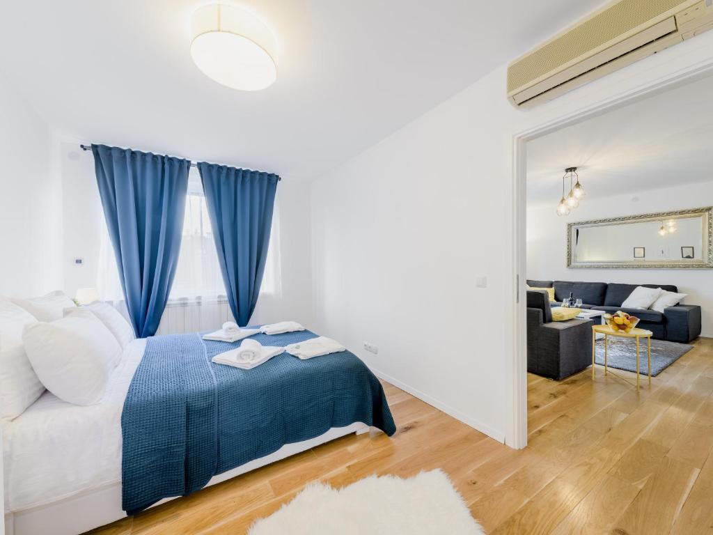 Łóżko lub łóżka w pokoju w obiekcie Superior Central Stay