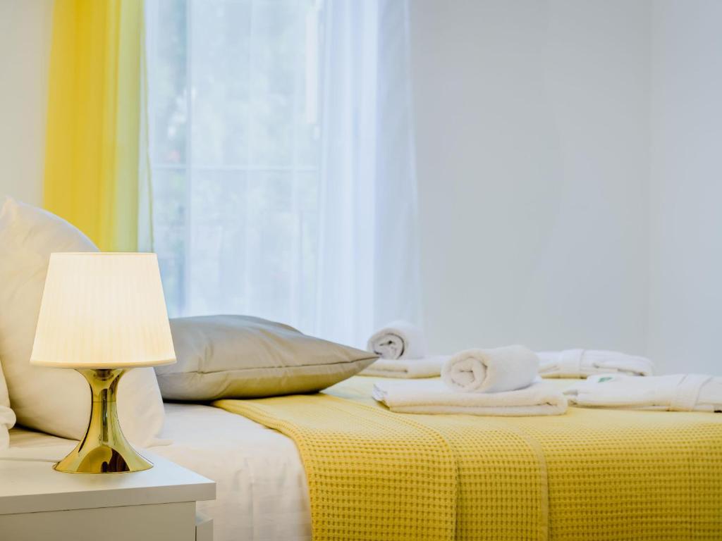 Łóżko lub łóżka w pokoju w obiekcie Superior Central Stay