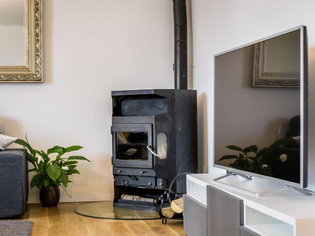 Telewizja i/lub zestaw kina domowego w obiekcie Superior Central Stay