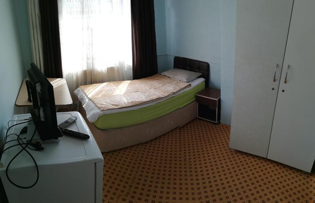 Postel nebo postele na pokoji v ubytování Esin Pansiyon