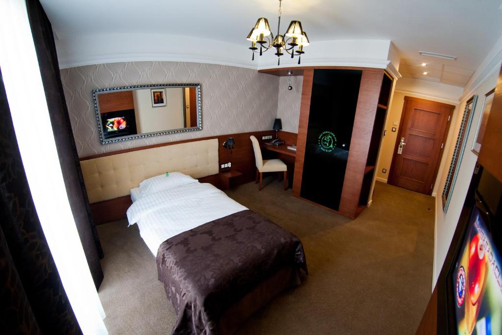 Postel nebo postele na pokoji v ubytování Hotel&Spa Kameleon