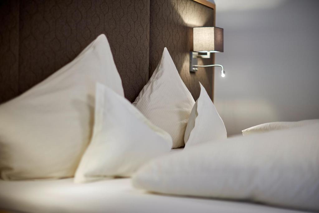 Кровать или кровати в номере Anthony´s Alpin Hotel Garni