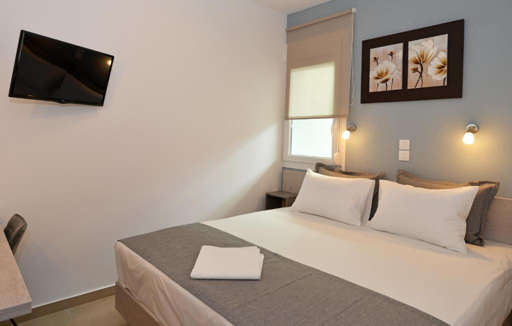 Postel nebo postele na pokoji v ubytování Iraklis Hotel