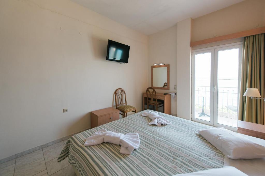 Postel nebo postele na pokoji v ubytování Plaz Hotel