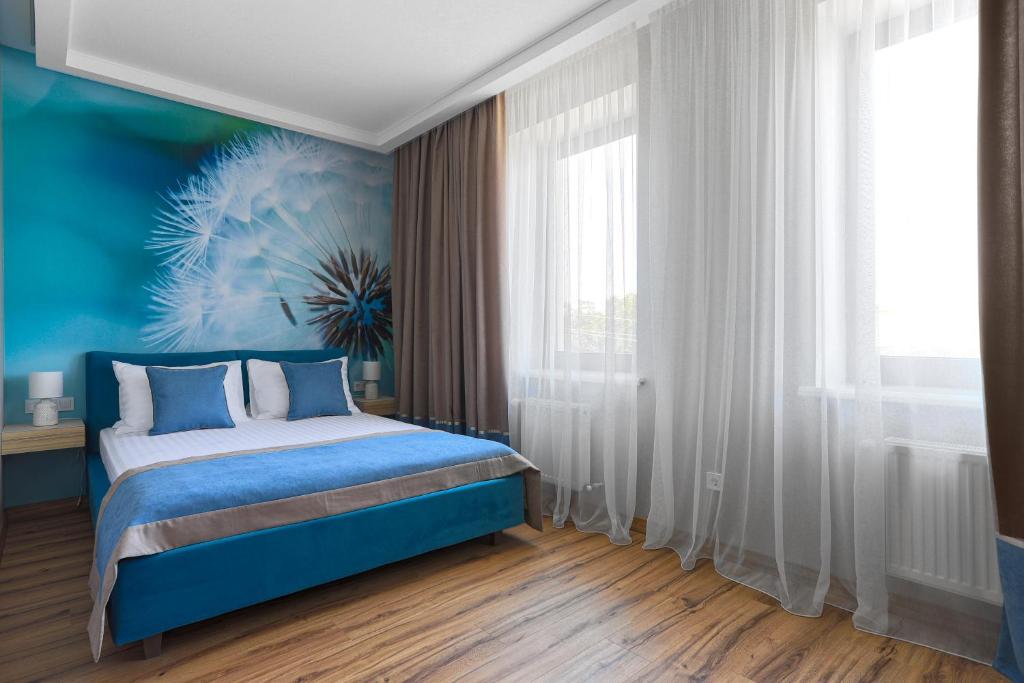 Postel nebo postele na pokoji v ubytování Redling Hotel