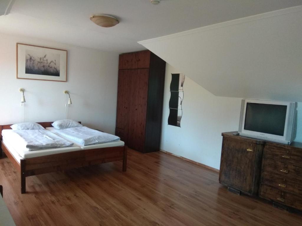 Cama o camas de una habitación en Velocafe Apartman