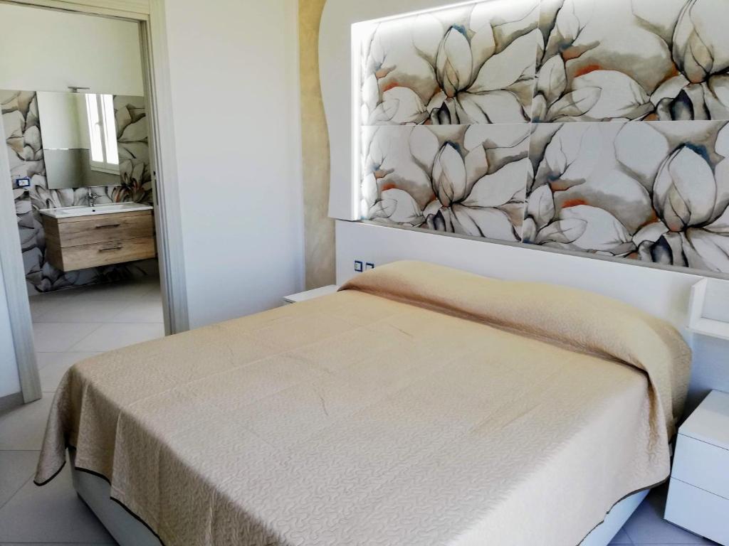 Posteľ alebo postele v izbe v ubytovaní Residence Tre Gemme