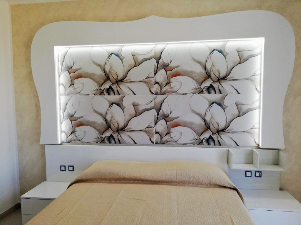 Posteľ alebo postele v izbe v ubytovaní Residence Tre Gemme