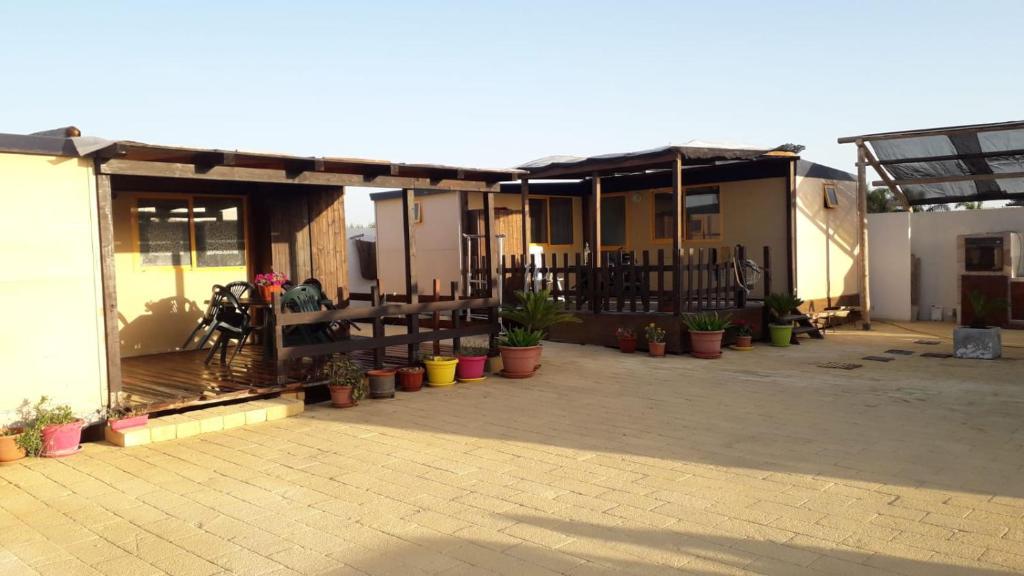 a patio of a house with potted plants at VILLAGGIO STAGNONE in Marsala