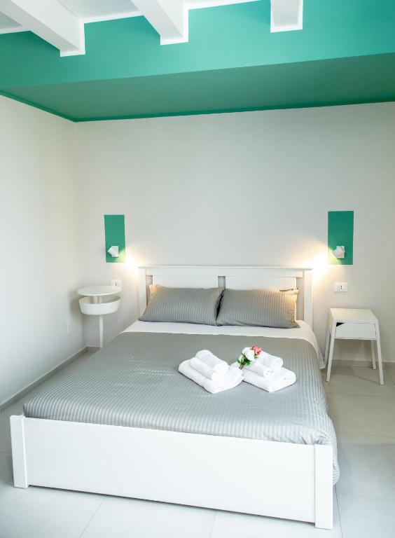 Postel nebo postele na pokoji v ubytování Guest House Nonnolorè