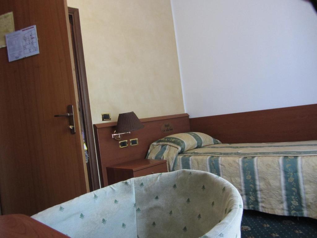 Postel nebo postele na pokoji v ubytování Hotel Green castellani