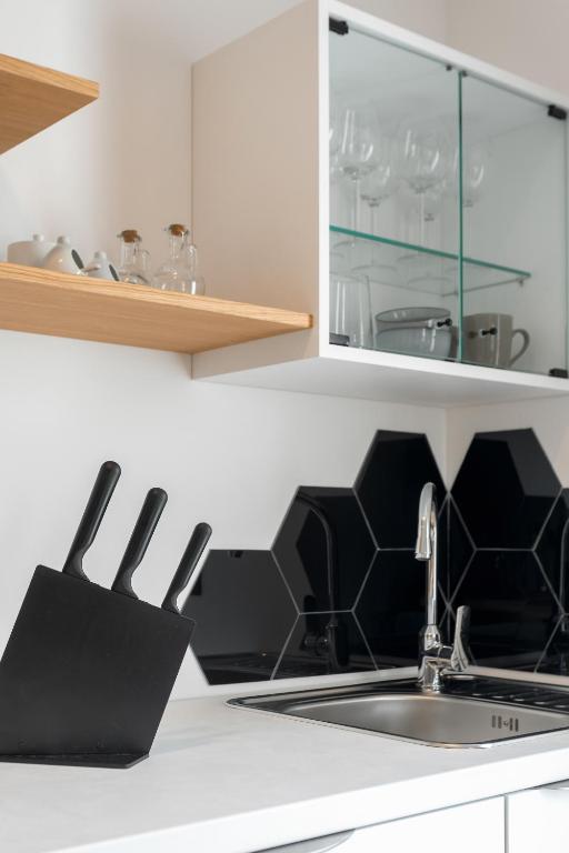 a kitchen with a sink and a counter at Hvar Top View Apartments in Hvar