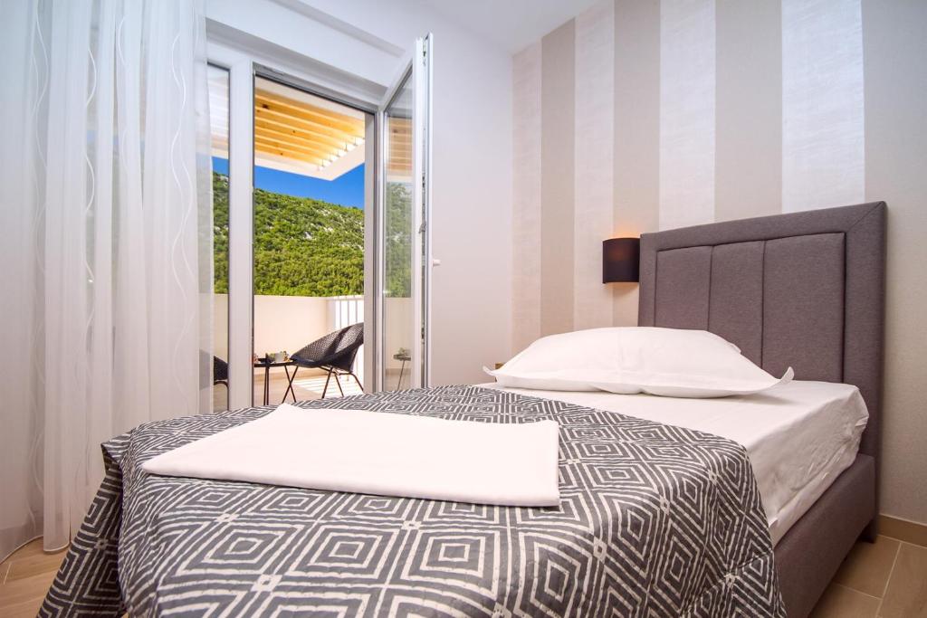 Postel nebo postele na pokoji v ubytování Villa Tela