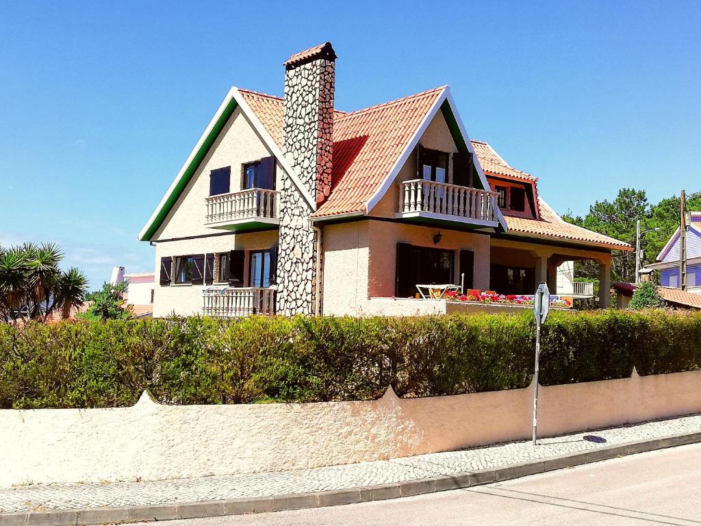 a house on the side of a street at Villa Ana in Nazaré