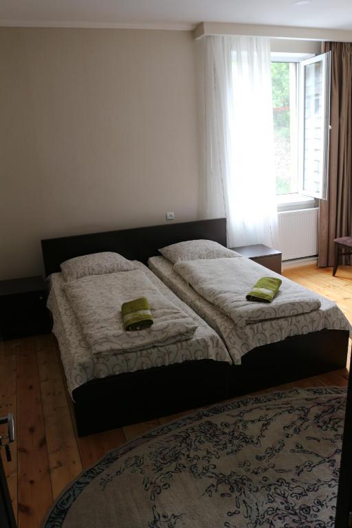 Postel nebo postele na pokoji v ubytování Guesthouse suja