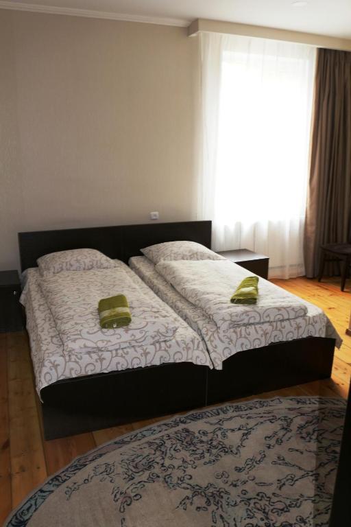 Postel nebo postele na pokoji v ubytování Guesthouse suja