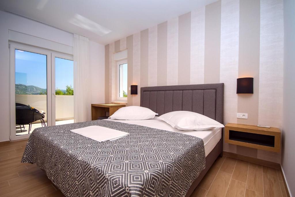 Postel nebo postele na pokoji v ubytování Villa Tela