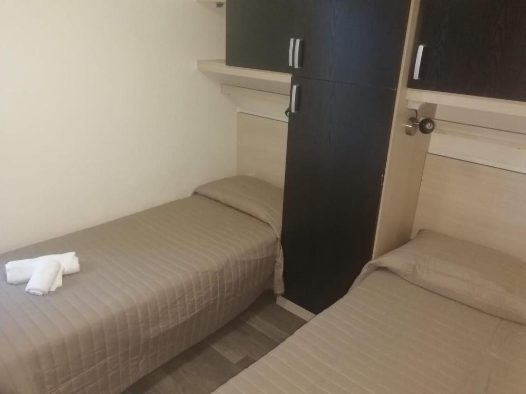 Postel nebo postele na pokoji v ubytování VILLAGGIO STAGNONE