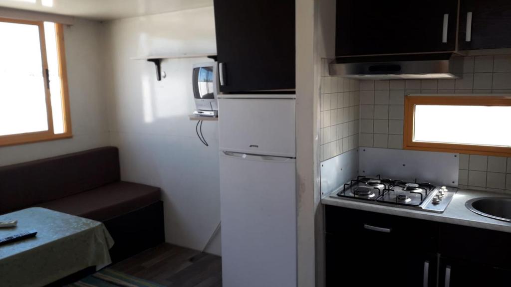 Kuchyň nebo kuchyňský kout v ubytování VILLAGGIO STAGNONE