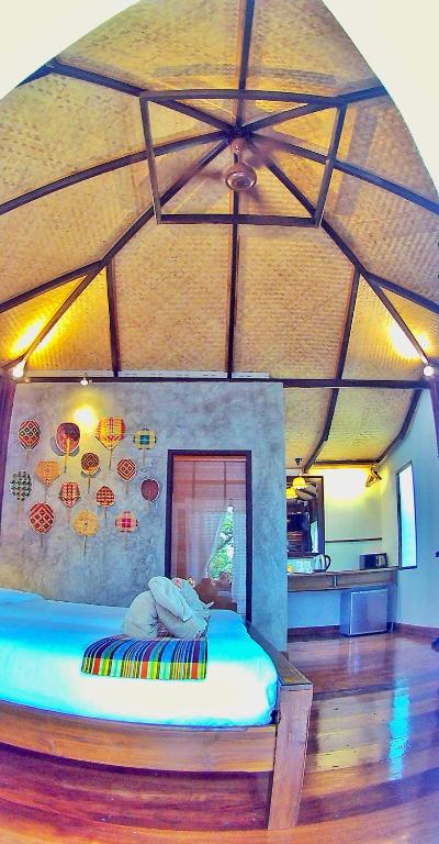 Postel nebo postele na pokoji v ubytování Mango House