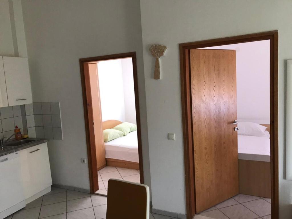 Postel nebo postele na pokoji v ubytování Apartments Nives