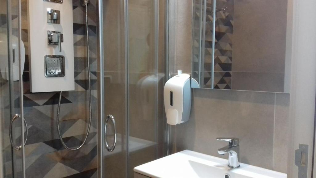 a bathroom with a sink and a shower at Dimora Villa Serena Porto Selvaggio in Santa Caterina di Nardò