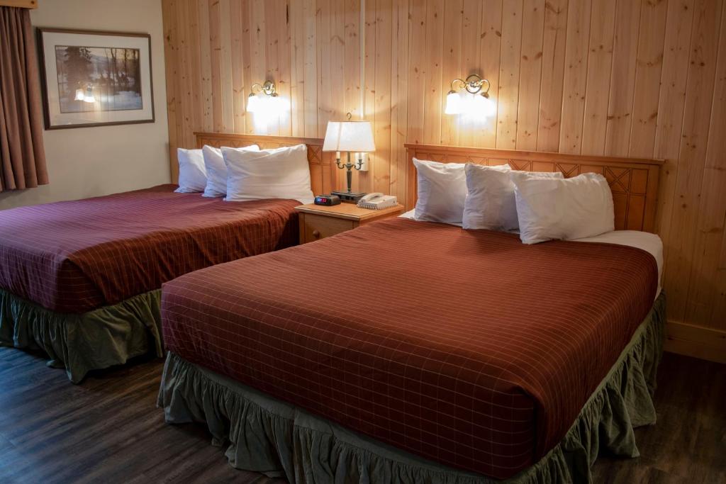 Postel nebo postele na pokoji v ubytování Aspen Village