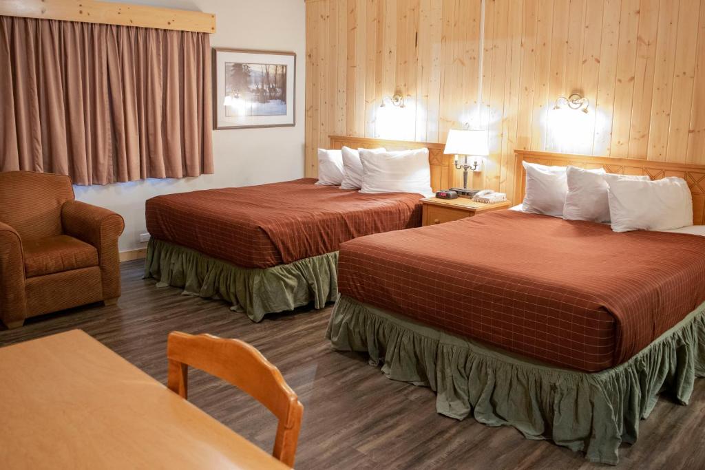 Postel nebo postele na pokoji v ubytování Aspen Village