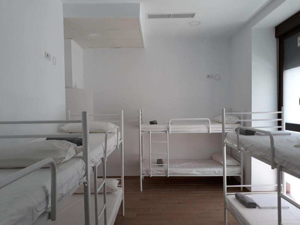 Postel nebo postele na pokoji v ubytování Hub Hostel Seville