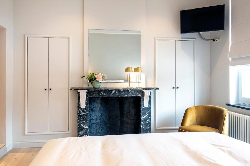 Postel nebo postele na pokoji v ubytování Bed & Breakfast Jezuietenplein 21