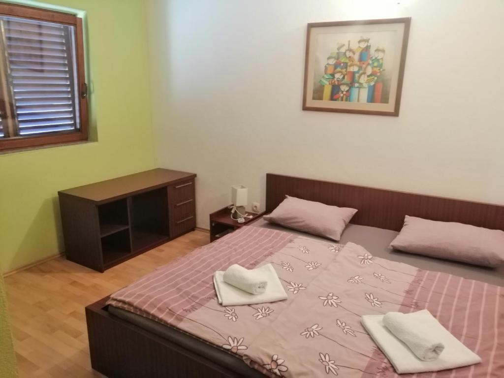 Postel nebo postele na pokoji v ubytování Hotel Ana Murter