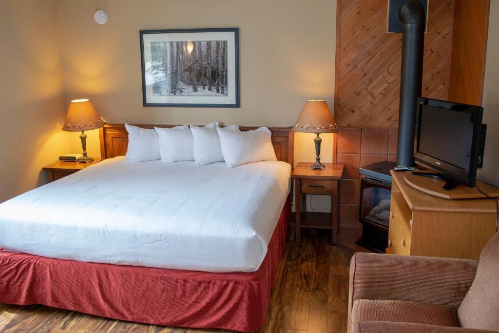 Postel nebo postele na pokoji v ubytování Aspen Village