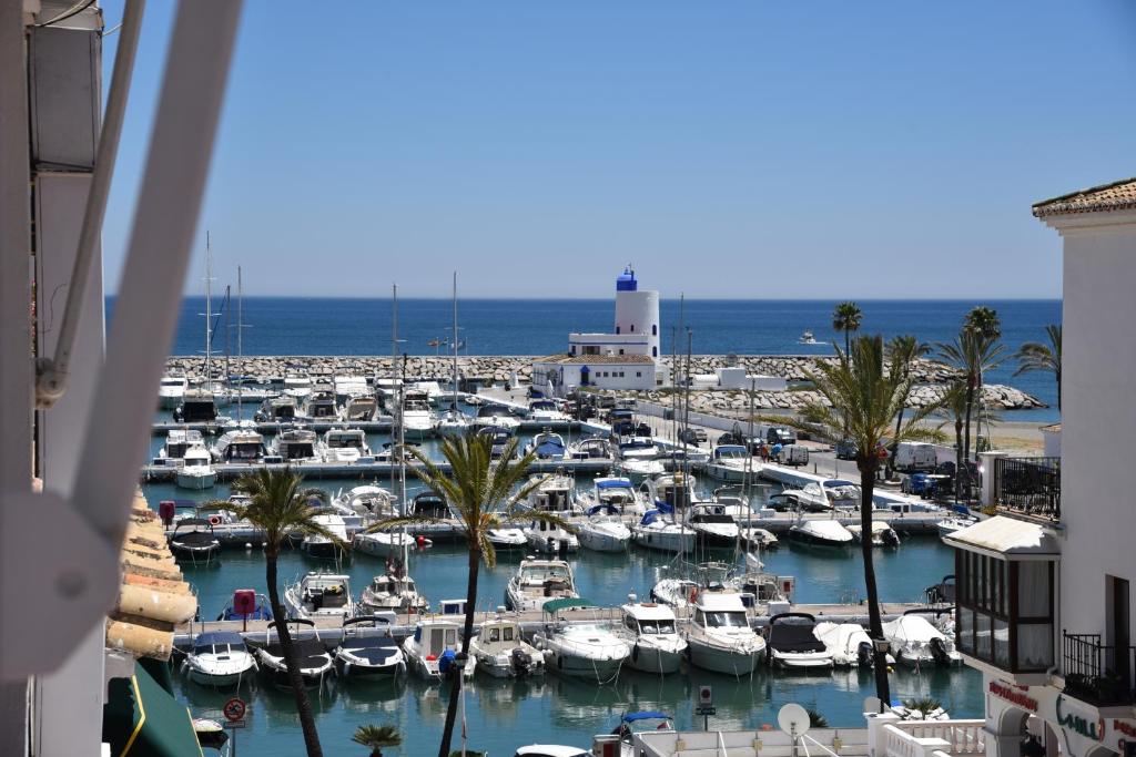 a marina with alot of boats in the water at Sea View Apartment in Manilva
