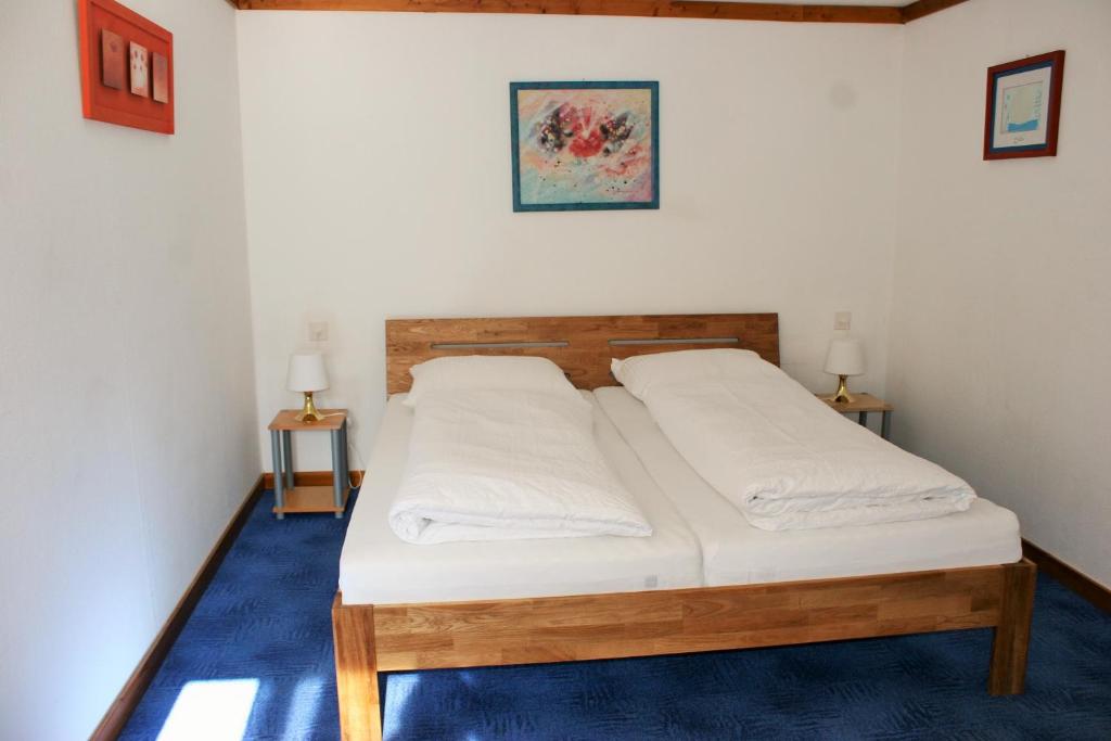 Postel nebo postele na pokoji v ubytování Hotel Gotthard