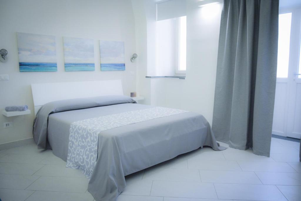 Postel nebo postele na pokoji v ubytování Luna Chiara Home