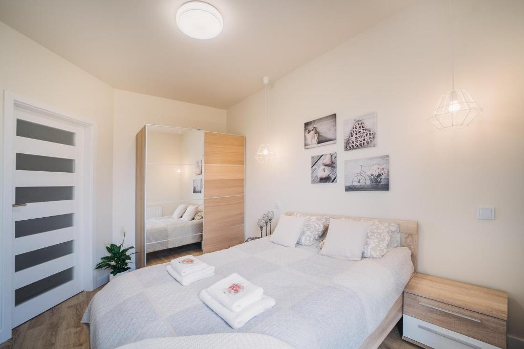 Posteľ alebo postele v izbe v ubytovaní Apartament Niko