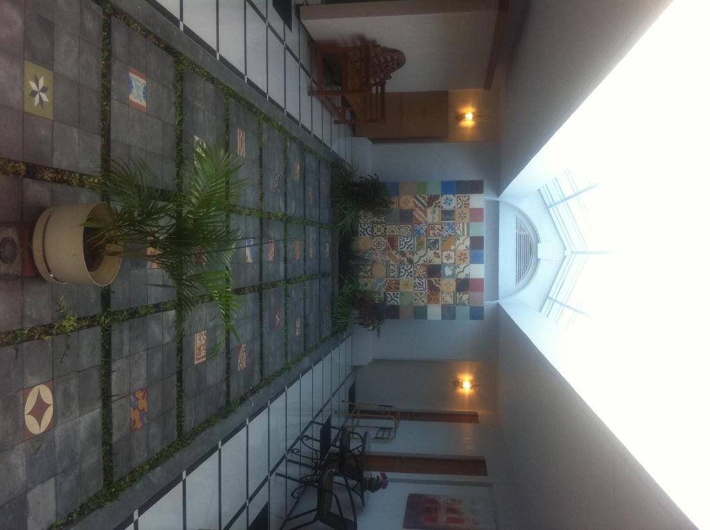 an overhead view of a building with plants on the wall at Panca Dewi Guest House in Yogyakarta