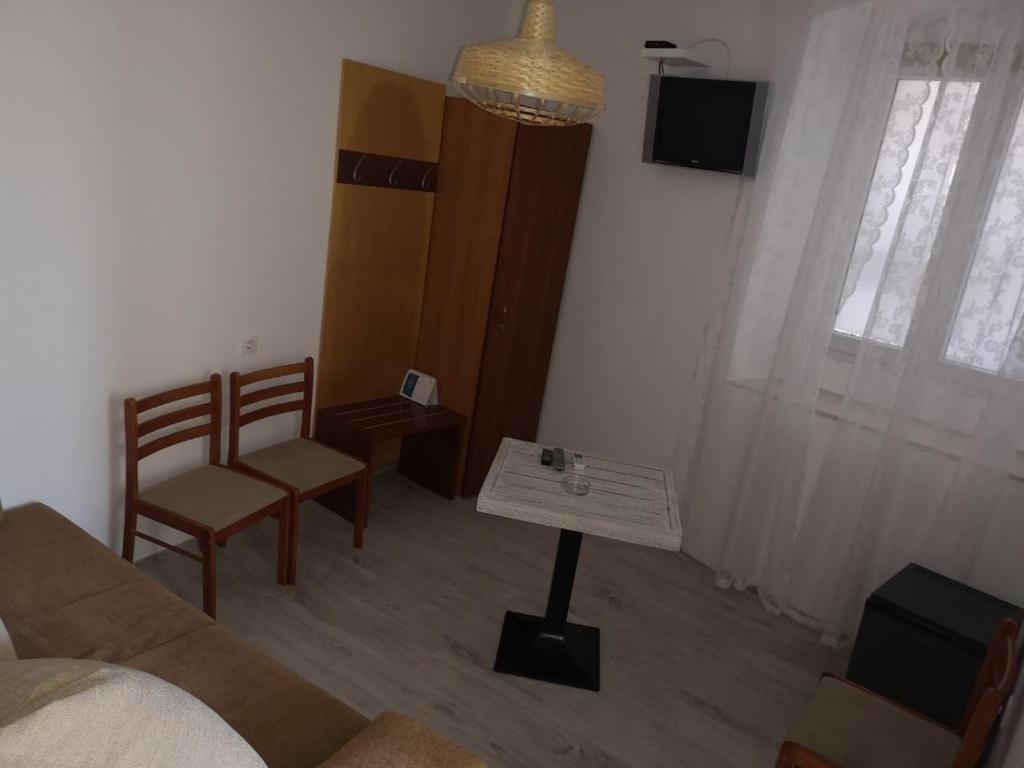 TV a/nebo společenská místnost v ubytování Main Bus Station Rooms