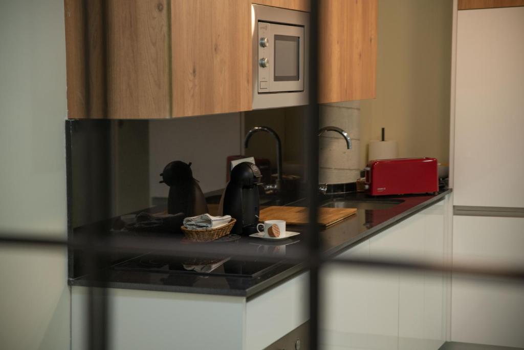 Kuchyň nebo kuchyňský kout v ubytování Soho Apartment Principal Avenue