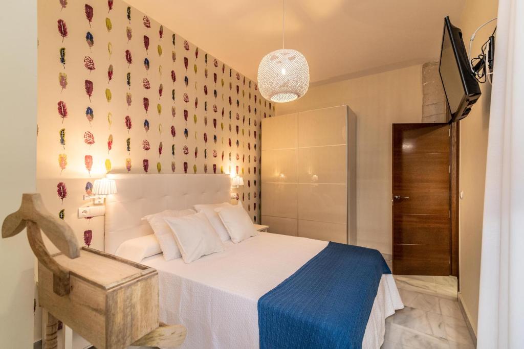 Postel nebo postele na pokoji v ubytování Soho Apartment Principal Avenue