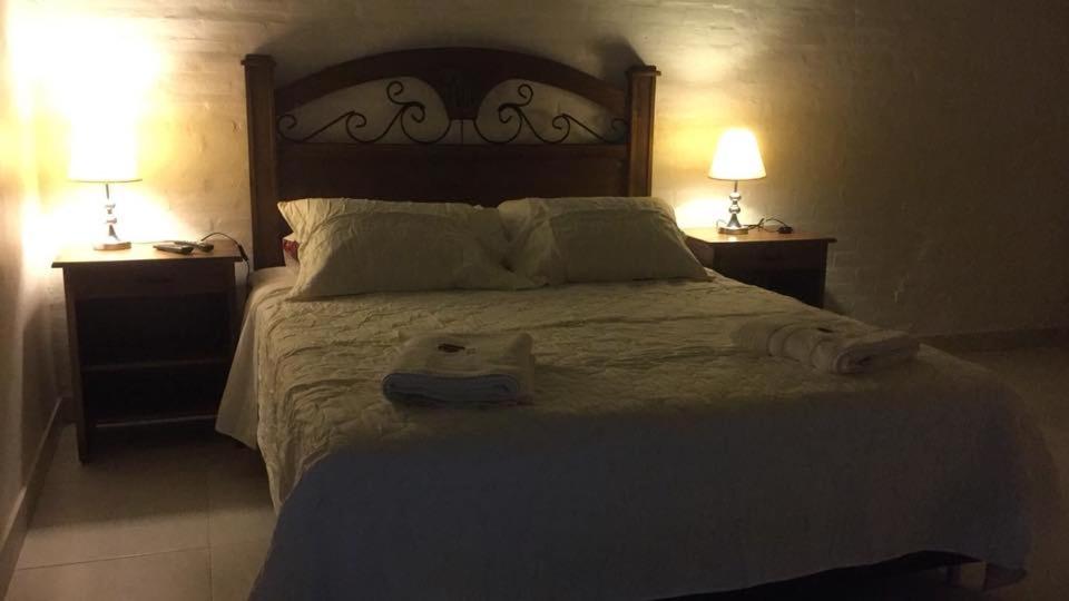 Postel nebo postele na pokoji v ubytování Sol de Luque Casa-hotel