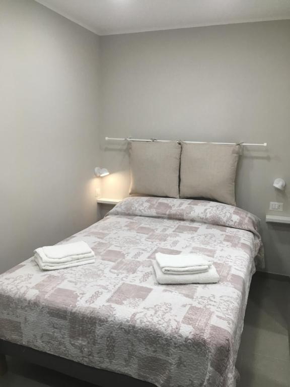 Łóżko lub łóżka w pokoju w obiekcie casa piano zero