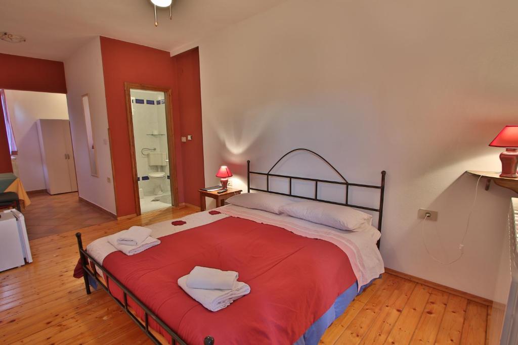 Postel nebo postele na pokoji v ubytování Rooms and Apartment Feral
