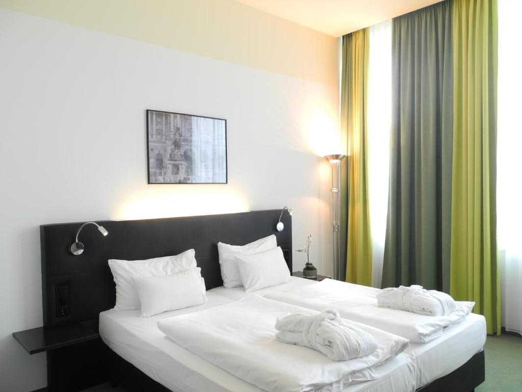 Letto o letti in una camera di Rainers Hotel Vienna